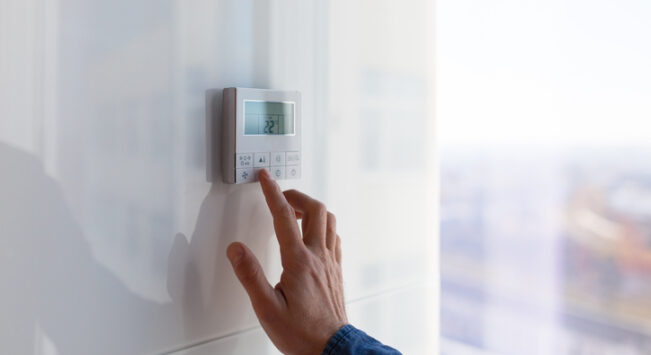 Commercial Heating and Cooling Peoria IL, The air conditioning and heating control panel for the apartment and office is located on a white wall