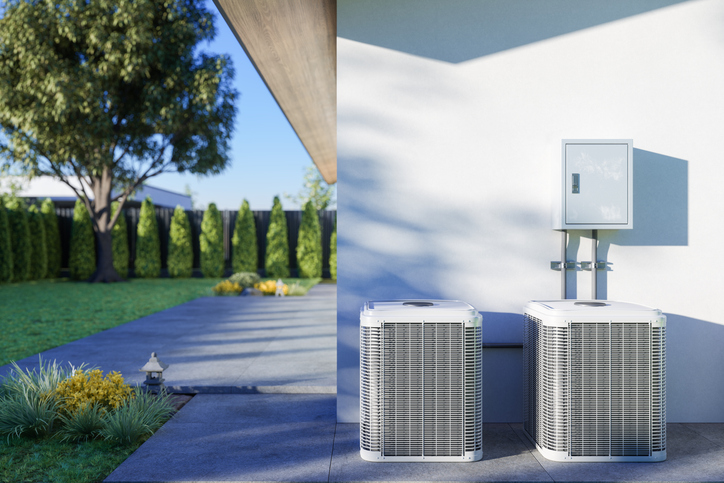 Commercial Heating and Cooling Peoria IL, Close-up View Of Air Conditioning Outdoor Units In The Backyard